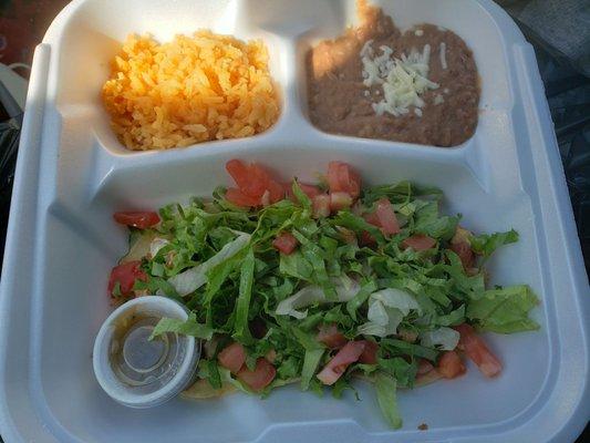 Chicken tacos (under lettuce), rice, beans