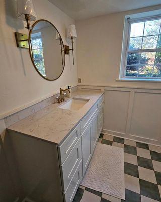 Bathroom after! Wainscoting, sconces, vanity and faucet, and fresh paint on the trim complete!