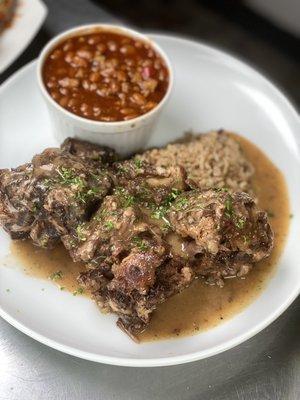 Caribbean Oxtails over rice & peas w/ baked beans