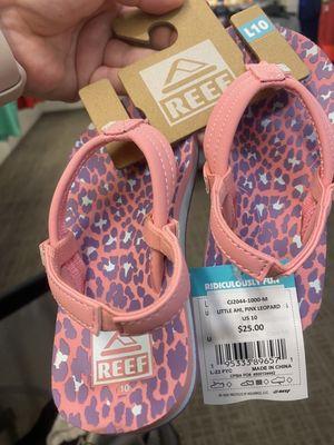 The shoes I was trying to purchase. The sign that says "all girls sandals, buy one get one for $1"