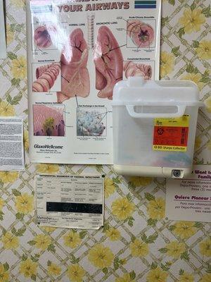 Random medical info stapled to the walls, probably to hide more stains.