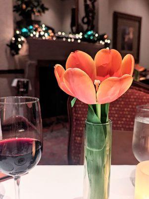 Beautiful fresh tulips in the fireplace room