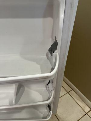 Refrigerator shelves with white duct tape that wouldn't hold any items