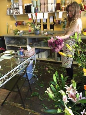 One of the staff members making an arrangement for another customer