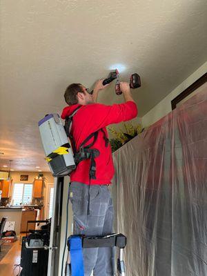 Investigating water damage coming in from the ceiling.