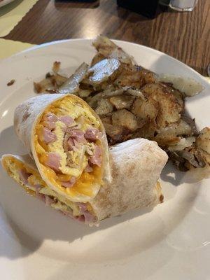 Breakfast burrito with side of home fries