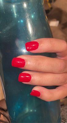 short red acrylic nails that are square shaped.