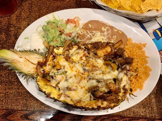 Pina Fajita with steak, beans and rice