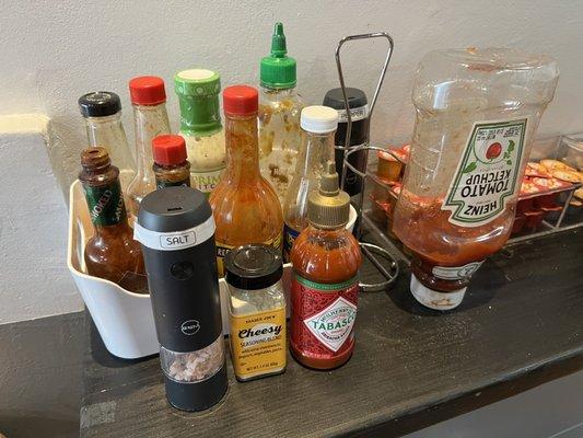 Many kinds of hot sauce and condiments