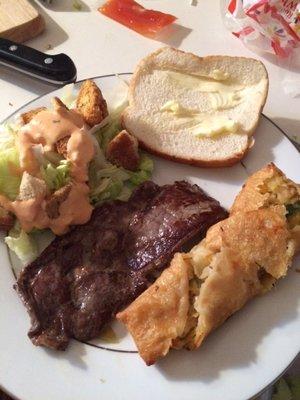 My white-trash meal:  Dollar Ribeye and Dollar Lobster Eggroll. Yuck but yum!