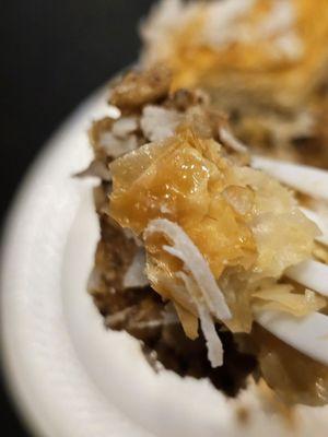 Close-up of a Baklava being held by a fork.