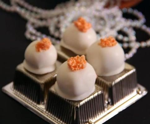 Our delicious Orange Dream Truffles; with a white chocolate ganache center made with orange pulp, juice, and orange zest.