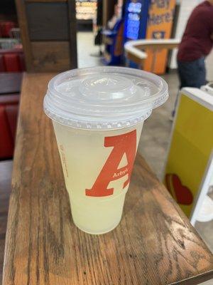 Medium drink cup with large lid on top