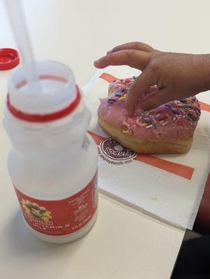 Small whole milk and strawberry iced with sprinkles