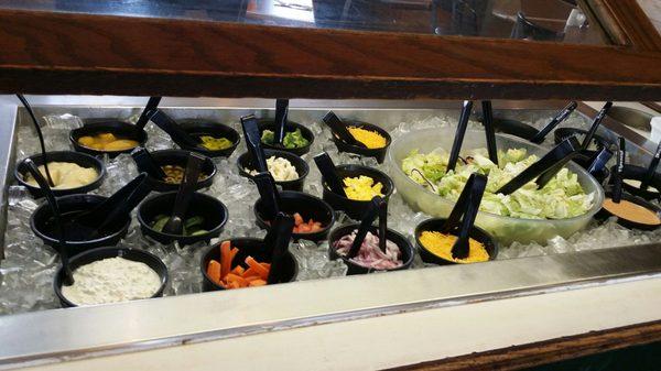 Salad bar with options sufficient for a vegetarian to make a meal.