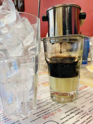 Traditional Vietnamese coffee served with glass of ice