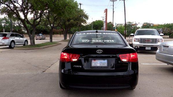 Rear view of our sweet Kia Forte. Call us for driving lessons!