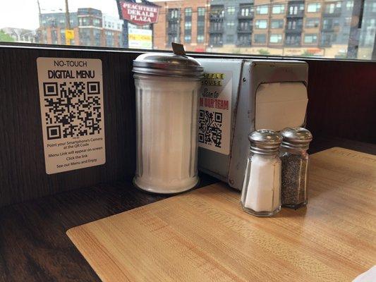 Virtual menu is available by scanning.  Condiments and napkins are available on each table.