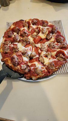 Small sausage and pepperoni pizza.