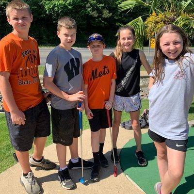 Kids at the Volcano Falls Mini Golf course at Funtrackers Family Fun Park in Hot Springs, AR