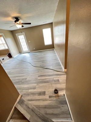 Expert Installation crews finishing a LVP flooring job.