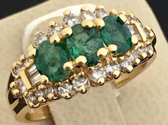 A classic emerald and diamond ring makes a ring more modern .