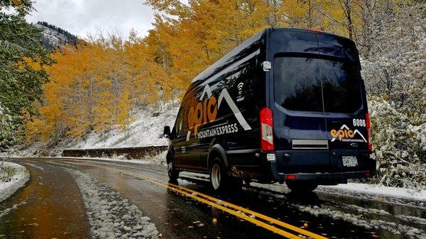 Epic Mountain Express Mercedes Sprinter Van in a snowy fall day.