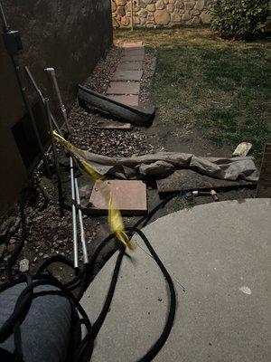 Patch-Up work. Yellow tape still there. Pieces not wires and metal objects left behind.