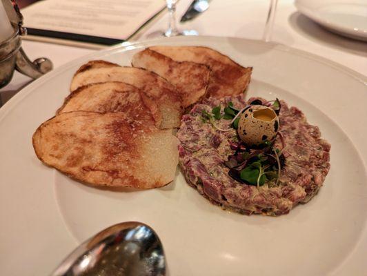 Beef Tenderloin Tartare. $18. Cornichon, capers, shallots, quail egg, potato crisp.