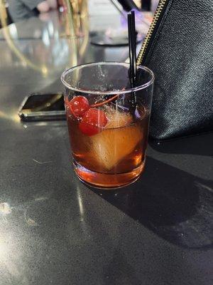 Manhattan UP with chemical cherries and real cherries. The bartender had no idea what to add so he added both...WTF!