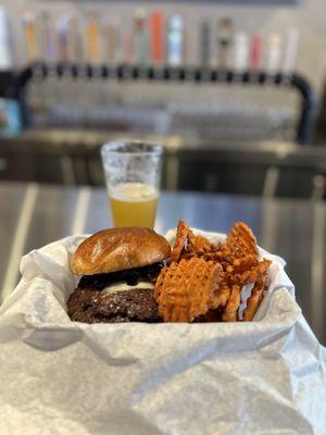 The "Trip" burger with sweet potato fries and a Pinthouse electric jellyfish IPA.