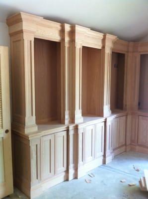 Custom Red Oak Bookcases made to our specifications!  Each column has 27 separate pieces of trim molding.  Beautiful!