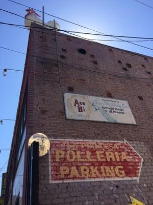 Parking in rear, rooster on roof.