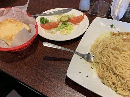 Nino's Italian bread, salad, and aglio e olio (garlic and olive oil) angel hair pasta.