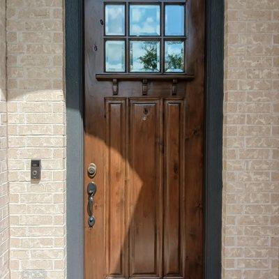 8 foot door full refinish (after) picture stained dark walnut with gloss finish Richmond Texas.