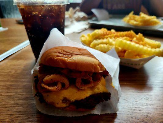 Hot meister burger, spicy fries, and a drink