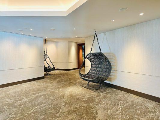 Hanging chairs in the hallway.