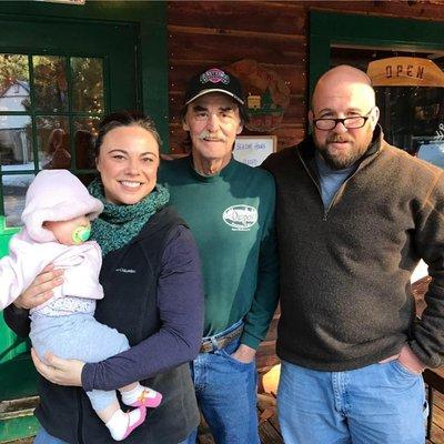 Bill Pritchard passes the baton off to new Outpost owners and operators Robb and Emma Jessee Gage with baby Maggie  Bess, too.