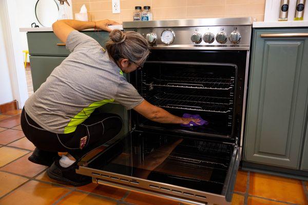 Inside stove cleaning service.