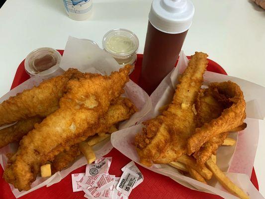 Huge portions, delicious meal! Chips are buried under all that fish!