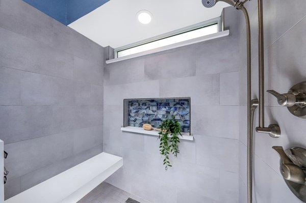 West Palmdale master bathroom remodel. Full walk-in shower custom tile with quartz floating bench and shampoo niche.