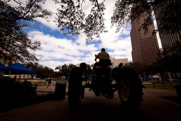 A tractor loading into Hermann Square Park for Rodeo-Round Up