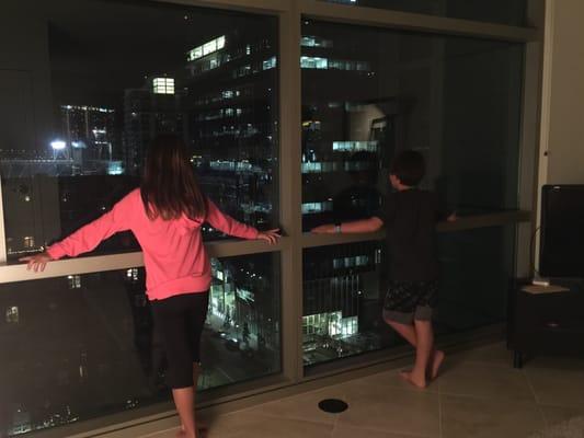 Night time view from floor to ceiling windows.