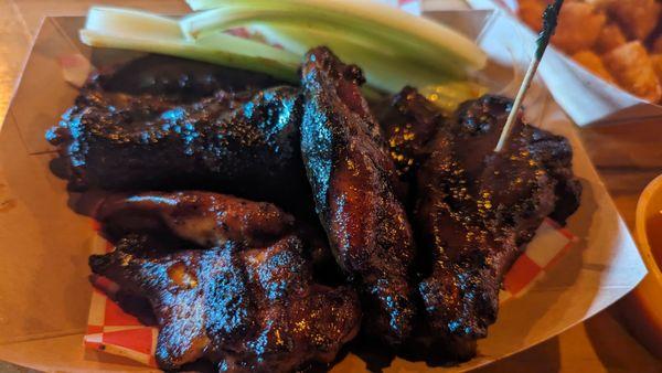 Charred grilled wings with spicy BBQ sauce