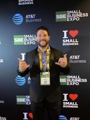 This is me styled & Dialed in front of the Small Business Expo Backdrop for the 2023 SBE in Atlanta!