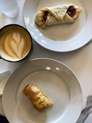 Photo of the Elm City Roasters 'Staccio Latte, the sausage roll, and the guava and cream cheese pastry.