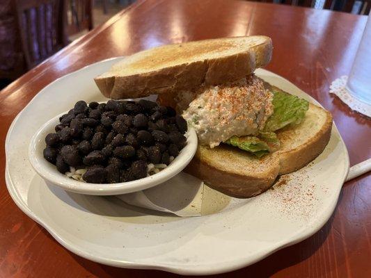 Shrimp salad sandwich with side of black beans and rice.