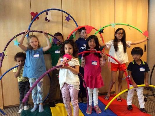 Showing off the hula-hoops they made at Family Fun Day!