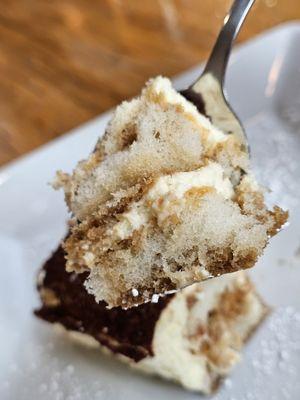 A spoonful of the Tiramisu dessert.