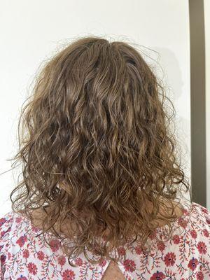 Curly long layers and a curly blowout